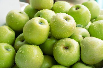 Lots of fresh green apples close together