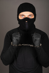 Man with black mask with handcuffs