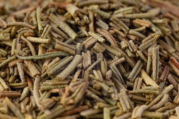 Pile of dried rosemary leaves. Food ingredient texture