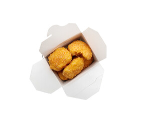 Tasty nuggets in paper box on white background