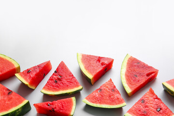 Slices of ripe watermelon on light background