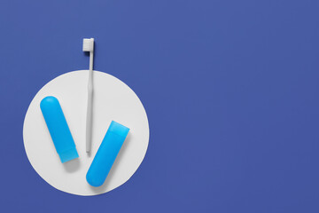 Toothbrush and case on color background