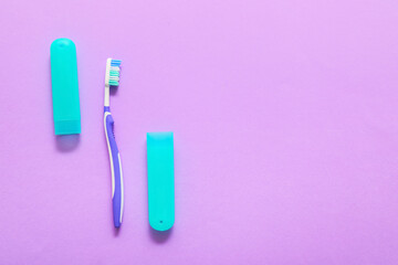 Toothbrush and case on color background