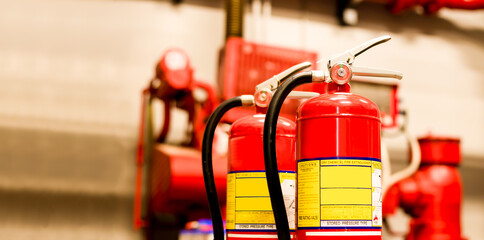 The red fire extinguisher is ready for use in case of an indoor fire emergency.