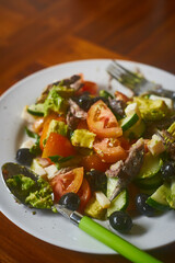   Close up mix salat in italian rustic style with olives and vegetables