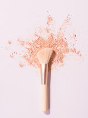 Make up brushes with powder on white background