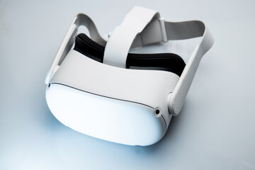 White new generation VR headset isolated on white background with blue sparkling futuristic lights. Virtual reality headset  