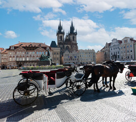 Naklejka na ściany i meble Prague Old Town with horse drawn carriage in foreground