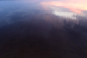 Lake water with light reflection at sunset