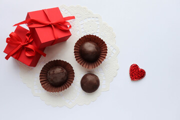 valentine'svalentine day background. gift box, red heart and chocolates