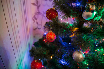 beautiful toys on the christmas tree with garland