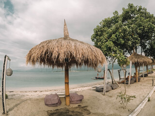 Brown nipa hut on beach