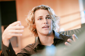 Caucasian businessman talking and gesturing