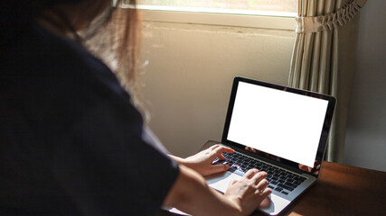 Woman working from home E learning home isolation auto quarantine woman working on laptop computer while sitting at the living room