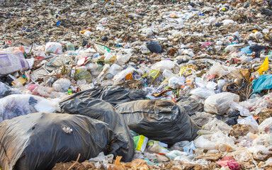 garbage dump pile in trash dump or landfill,truck is dumping the gabage from municipal,garbage dump...