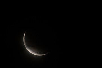 Obraz na płótnie Canvas New moon on dark sky