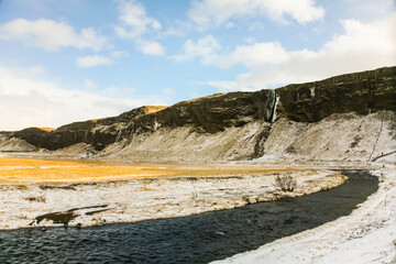 Winter landscape in Seljalandsfoss waterfall, Iceland, Northern Europe