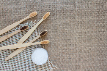 Natural bathroom essentials in zero waste home - bamboo toothbrushes and kaolin dentifrice or tooth...