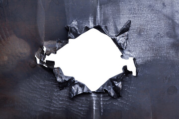 Torn hole on a metal background. - obrazy, fototapety, plakaty