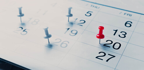 Calendar page pinned in a calender on datebusiness meeting schedule, travel planning or project milestone and reminder concept.