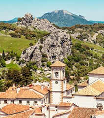 Fototapeta na wymiar White houses of Grazalema surrounded by mountains in Spain