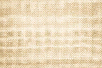 Jute hessian sackcloth canvas woven texture pattern background in light beige cream brown color blank empty