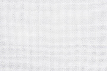 White fabric jute hessian sackcloth canvas woven gauze texture pattern in light white color blank. Natural linen and cotton cloth texture as clean background empty for decoration.