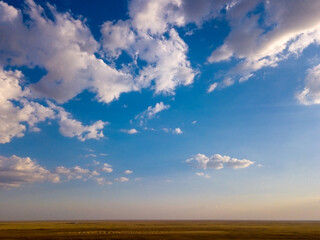 Blue sky and clouds with horizon on sunset