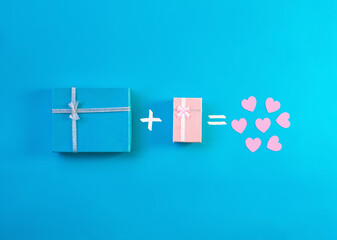 Gift boxes decorated with ribbon, small hearts on blue background, copy space. Flat lay, pink and blue present boxes, top view. Valentine or love, spring holidays, Christmas and birthday concept.