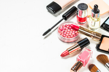 Makeup professional cosmetics on white marble background.