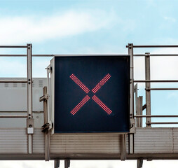 Sign with a red cross lit