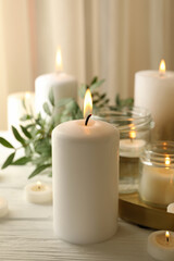 Fototapeta na wymiar Burning scented candles for relax on white wooden table