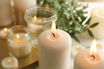 Fototapeta na wymiar Burning scented candles for relax, close up