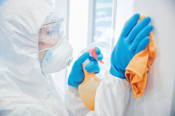 Fototapeta premium Medical staff cleaning and disinfection with antiseptics of viruses and germs, cleaner service against coronavirus