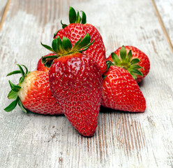 Strawberries surrounded by rustic background