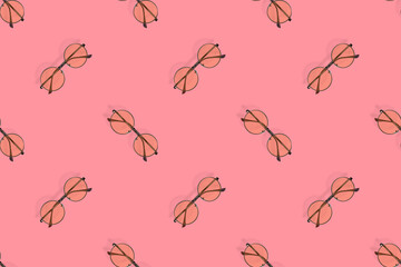 Glasses seamless pattern. Glasses for improving vision on a red background.