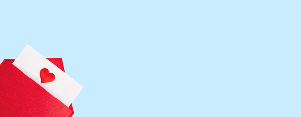 Banner red open envelope with a sheet of paper with a heart on a blue background with copyspace. Valentines day holidays concept and love notes