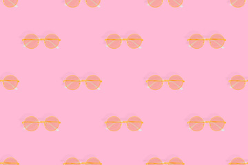 Glasses seamless pattern. Glasses for improving vision on a pink background.