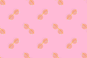Fototapeta premium Glasses seamless pattern. Glasses for improving vision on a pink background.