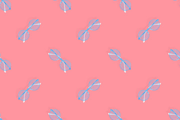 Glasses seamless pattern. Glasses for improving vision on a red background.