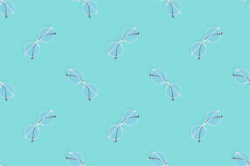 Glasses seamless pattern. Glasses for improving vision on an aquamarine background.
