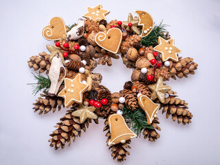 Christmas decorations with pine cones, nuts and handmade Christmas cookies