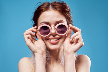 Fototapeta premium beautiful woman naked shoulders fluffy earrings sunglasses accessories makeup