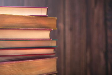 Pile of old books on the table. Wisdom of world hidden in the book. Learning. Education.