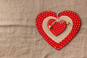 Flatlay heart on a linen tablecloth. Valentine's Day background. Copy space.