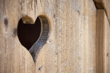 hearth shape over a wooden balcony in a small alpine cabine