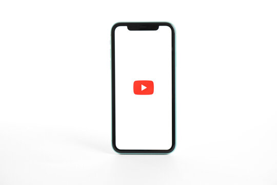 MYKOLAIV, UKRAINE - JULY 9, 2020: iPhone 11 with Youtube app on screen against white background