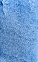 abstract cracking and peeling blue paint on old rough wall textured background