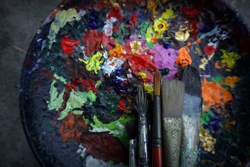   Photo of paintbrushes closeup and artist palette from thailand   ,   Palette , paintbrush