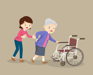 Women helping elderly patients to wheelchair